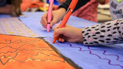 Newcroft - a young people's hands as they draw 