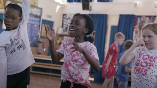 Three children dancing