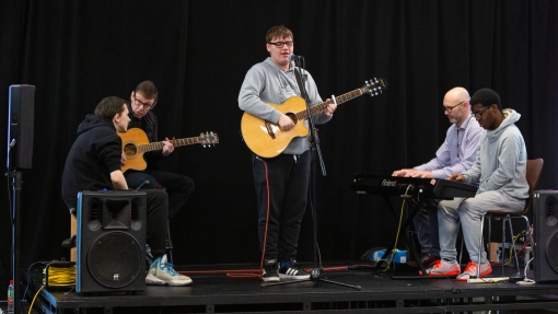 People playing musical instruments on stage