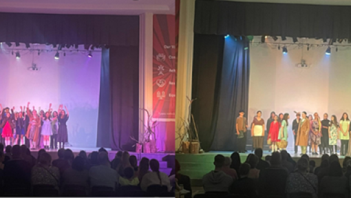 Stage with pupils performing 