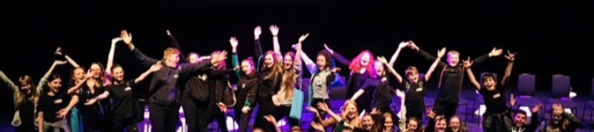 Students performing on stage