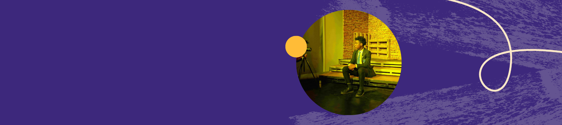 student sat on stage