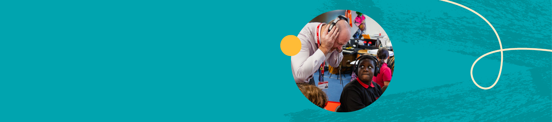  Teacher listening to children play musical instruments