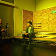 student sat on stage